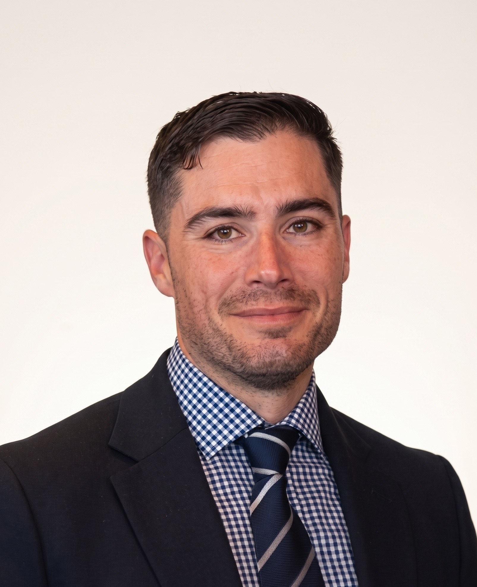 Professional headshot of James Sarner against a white background